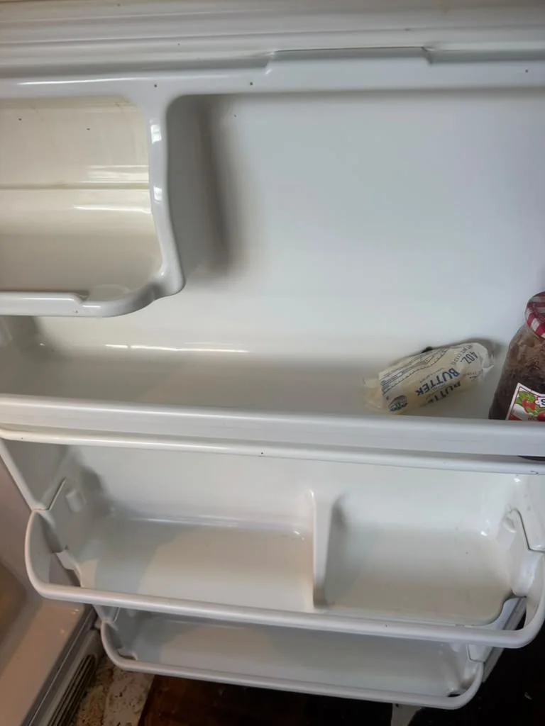 Refrigerator door shelves after cleaning, wiped clean and free of spills