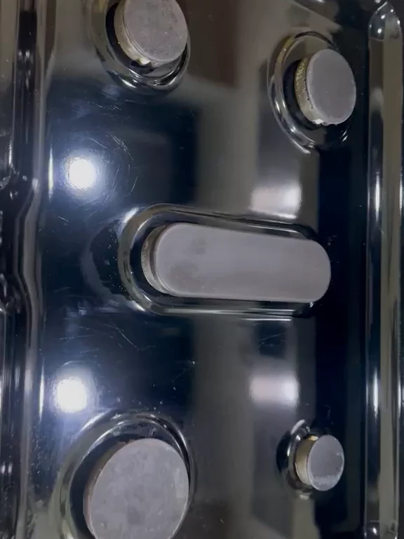 The same stovetop after cleaning, black surface polished and clear